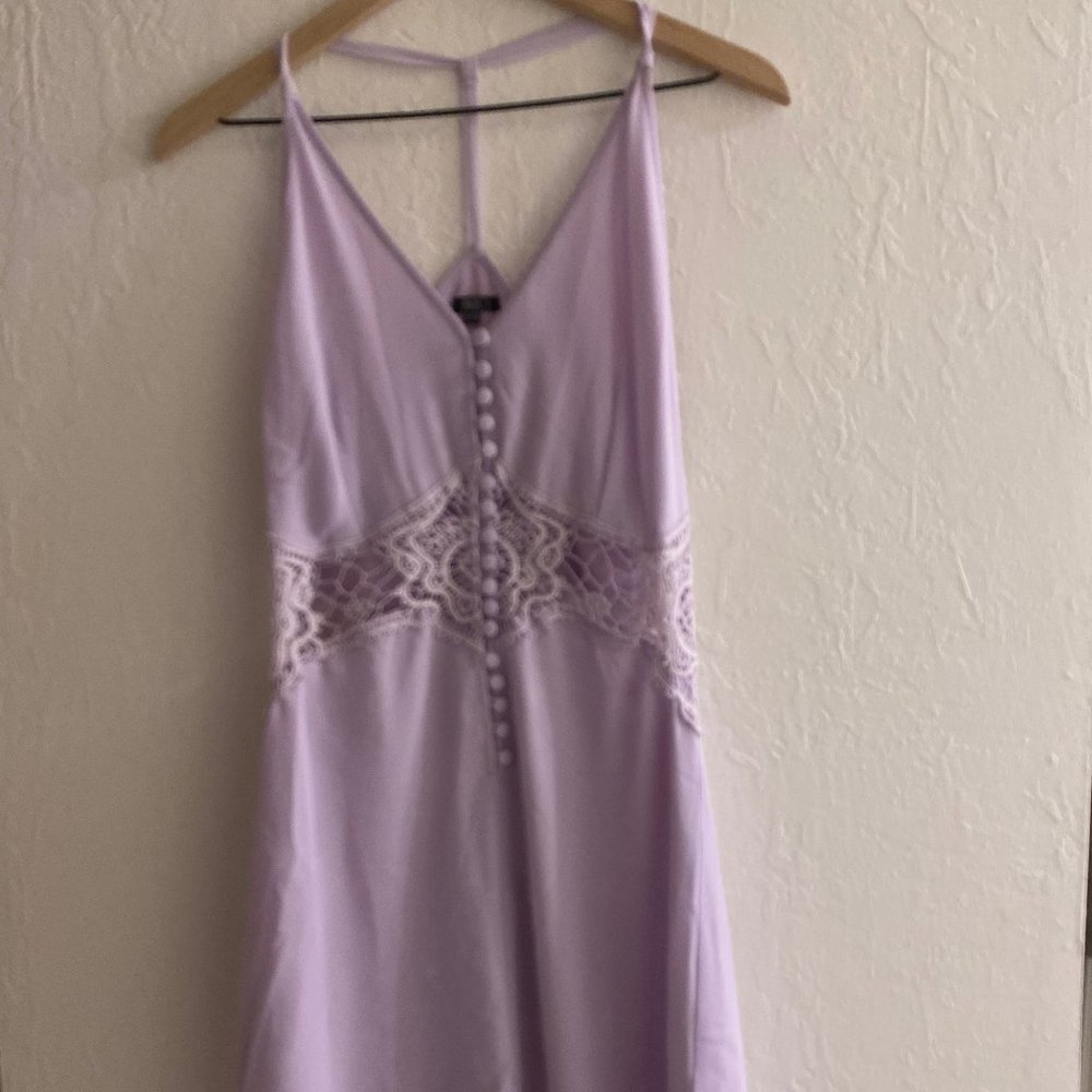 Lavender dress with cut-out middle.